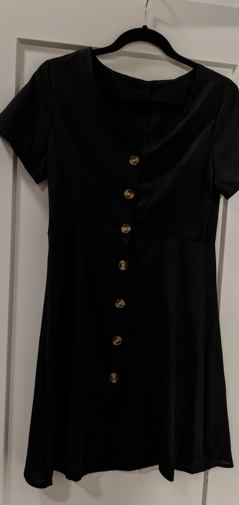 Black button up dress. Bought online never worn.